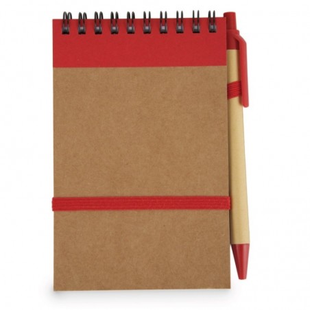 Libreta roja con bolígrafo rojo y adhesivo frase