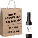 Vino personalizado con nombre de invitado y novios presentado en bolsa con dedicatoria