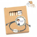 Set de dibujo y pulsera presentado en bolsa azul para comunión de niño