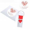 Llavero de aluminio troquelado de corazón y cinta roja en estuche de presentación con adhesivo romántico