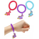 Pulsera de unicornio y pompero en bolsa de organza morada con etiqueta de unicornio para invitados